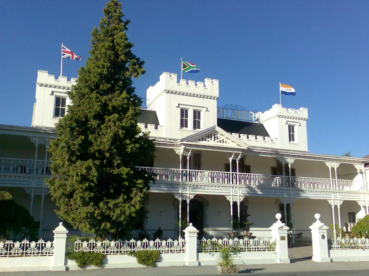 The Victorian red-and-white facade of the Lord Milner Hotel in Matjiesfontein, Karoo