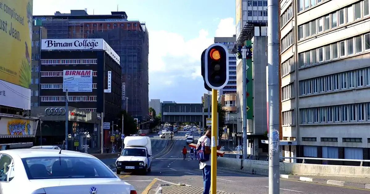 Johannesburg highway interchange with traffic, illustrating the roads a new South African driving licence is issued for.